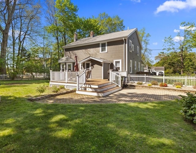 71 Dudley St, Marlborough, MA 01752 - rear view of house featuring a wooden deck and a chimney