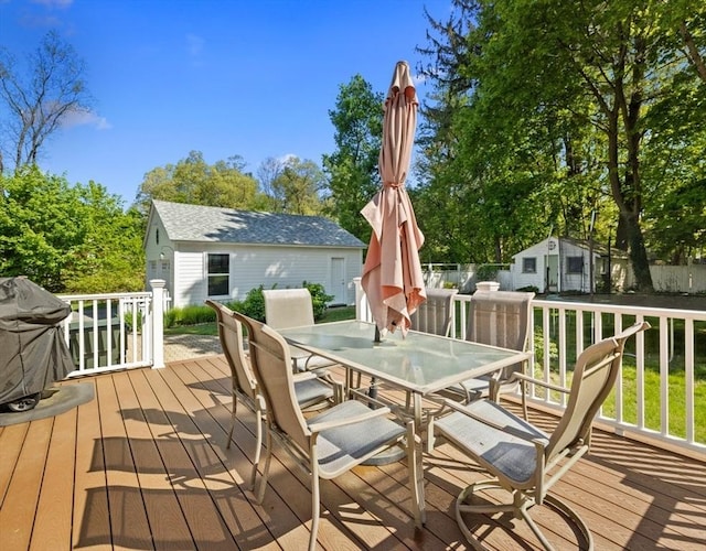 71 Dudley St, Marlborough, MA 01752 - wooden deck featuring outdoor dining space, an outdoor structure, and grilling area