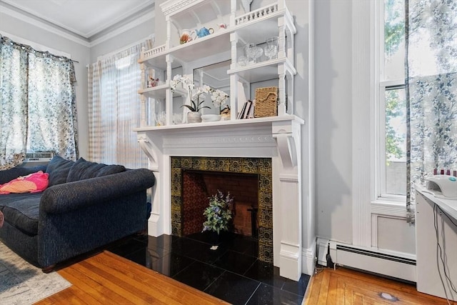 living room with a wealth of natural light, a fireplace with flush hearth, baseboard heating, and crown molding