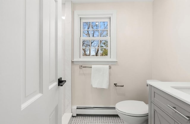 bathroom with toilet, a baseboard radiator, and vanity