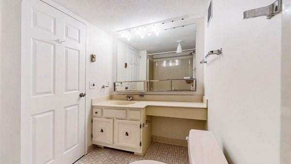 250 Hammond Pond Pkwy Unit 707S, Newton, MA 02467 - bathroom with vanity, tile patterned floors, and toilet