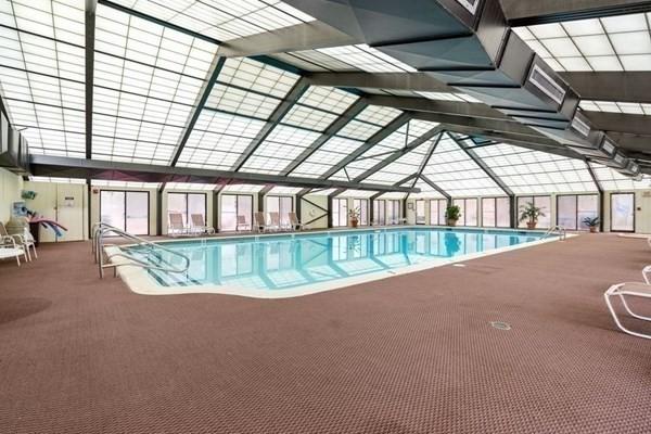 250 Hammond Pond Pkwy Unit 707S, Newton, MA 02467 - indoor community pool with a patio area