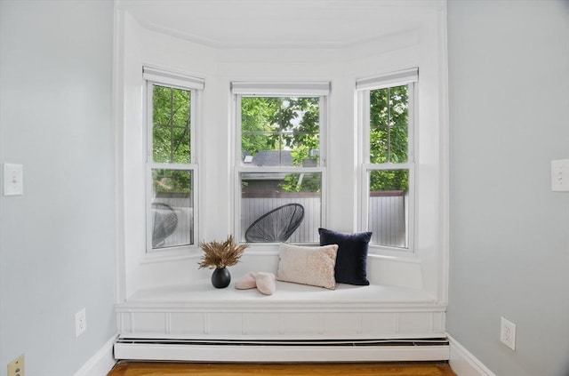 mudroom with baseboard heating, plenty of natural light, and baseboards