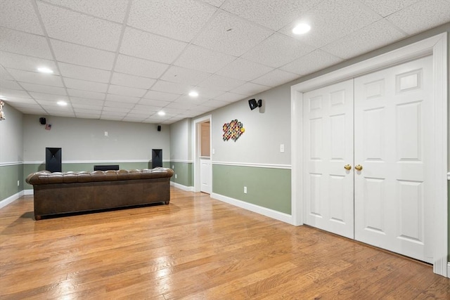 living area with baseboards and light wood-style floors