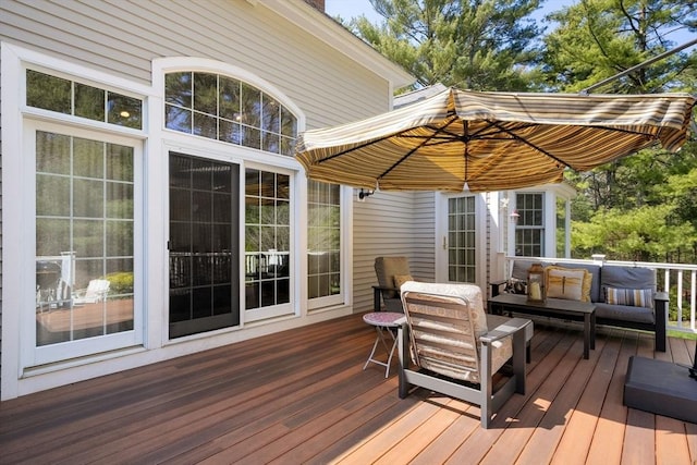 wooden deck featuring an outdoor living space