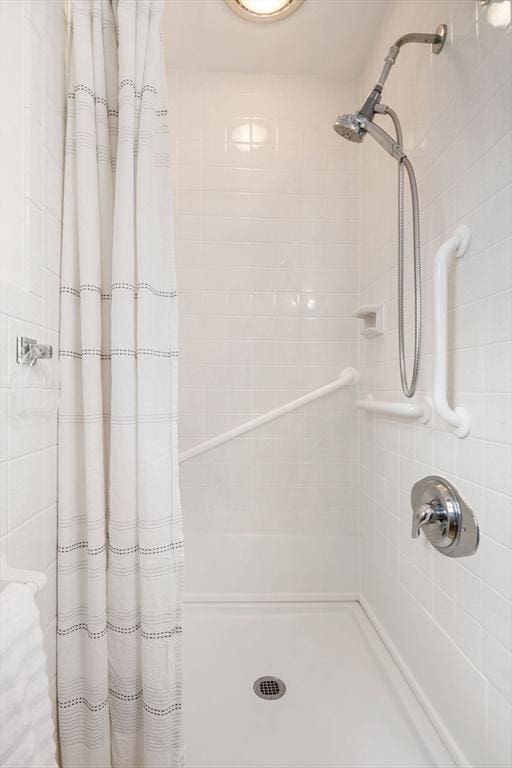 bathroom with a tile shower