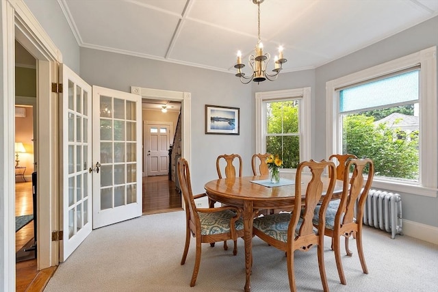 102 Chestnut St, Andover, MA 01810 - dining room featuring french doors, a chandelier, light carpet, and baseboards