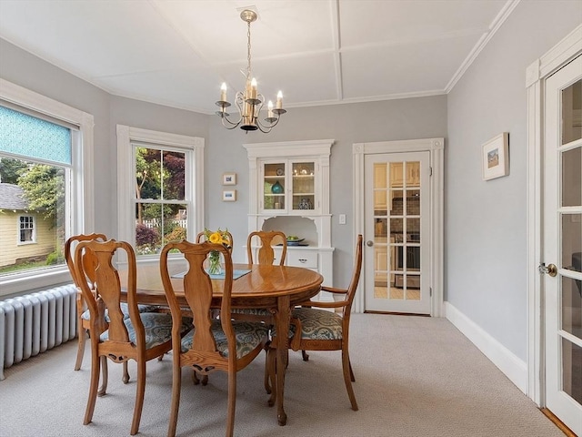 102 Chestnut St, Andover, MA 01810 - dining room with light colored carpet, a chandelier, radiator heating unit, crown molding, and baseboards