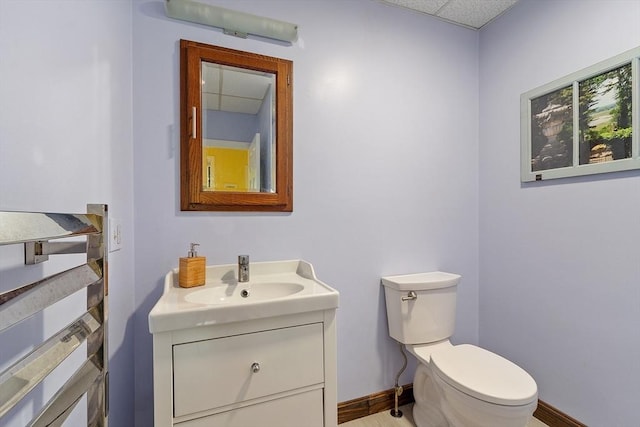 102 Chestnut St, Andover, MA 01810 - bathroom with vanity, toilet, and baseboards