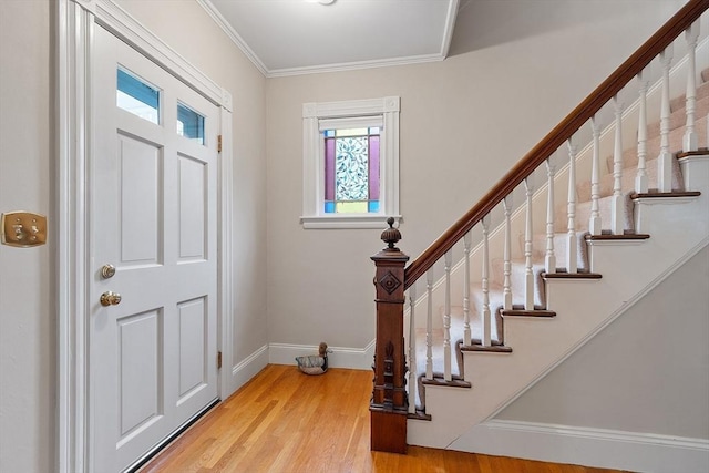 102 Chestnut St, Andover, MA 01810 - foyer entrance with healthy amount of natural light, light wood-style floors, baseboards, stairs, and crown molding