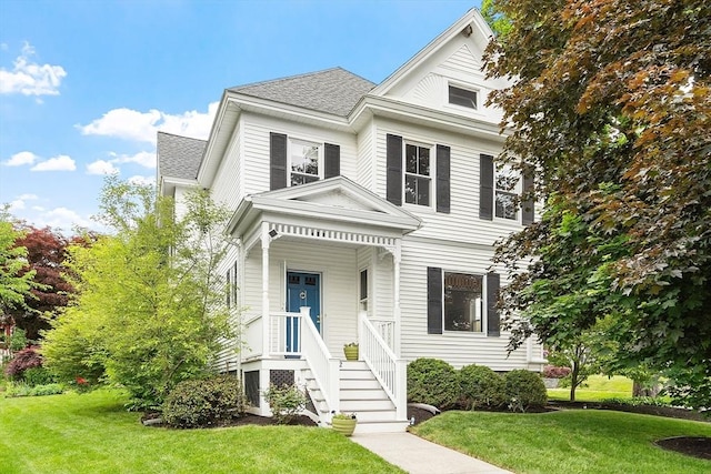 102 Chestnut St, Andover, MA 01810 - view of front of house with a front yard and roof with shingles