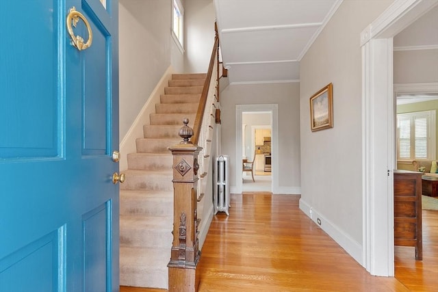 102 Chestnut St, Andover, MA 01810 - entrance foyer featuring light wood finished floors, stairway, baseboards, and ornamental molding
