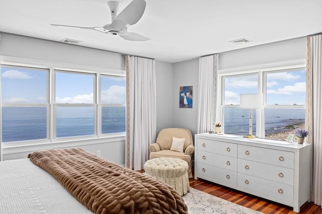 55 Seaside Rd, Scituate, MA 02066 - bedroom featuring a water view, wood finished floors, and a ceiling fan
