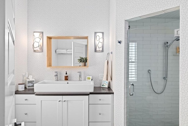 55 Seaside Rd, Scituate, MA 02066 - bathroom with a shower stall, vanity, and wallpapered walls