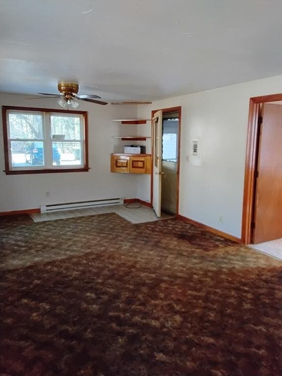 unfurnished living room with a baseboard heating unit, baseboards, a ceiling fan, and light colored carpet