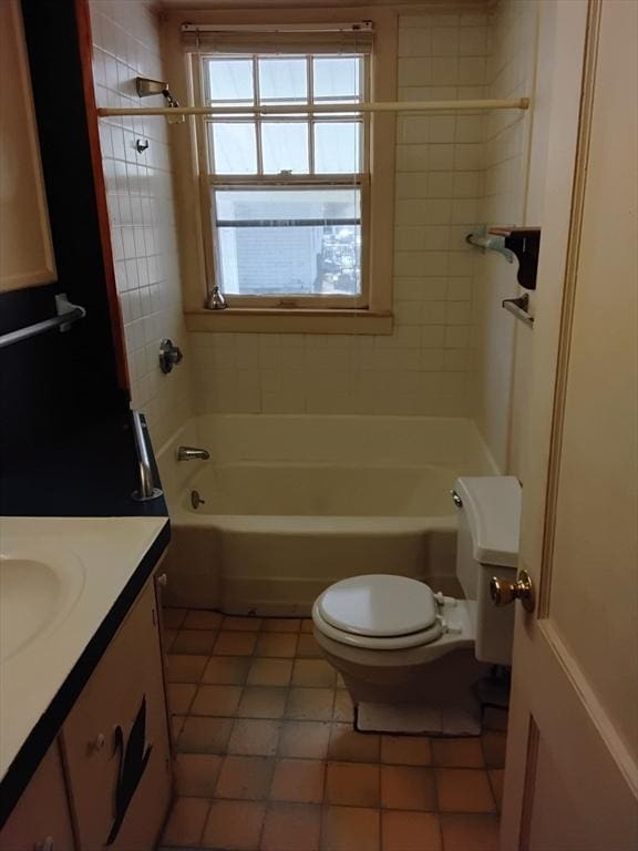 bathroom with toilet, tile patterned floors, bathtub / shower combination, and vanity