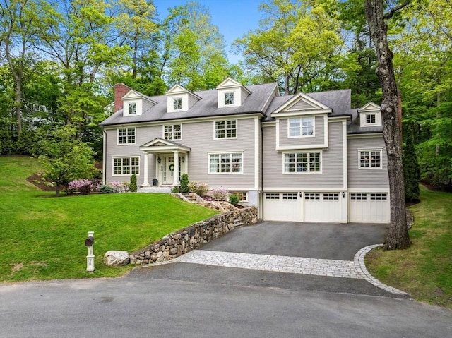 50 Temple Rd, Wellesley, MA 02482 - shingle-style home featuring an attached garage, driveway, and a front lawn