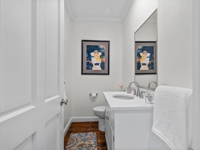 50 Temple Rd, Wellesley, MA 02482 - bathroom with wood finished floors, baseboards, ornamental molding, toilet, and vanity