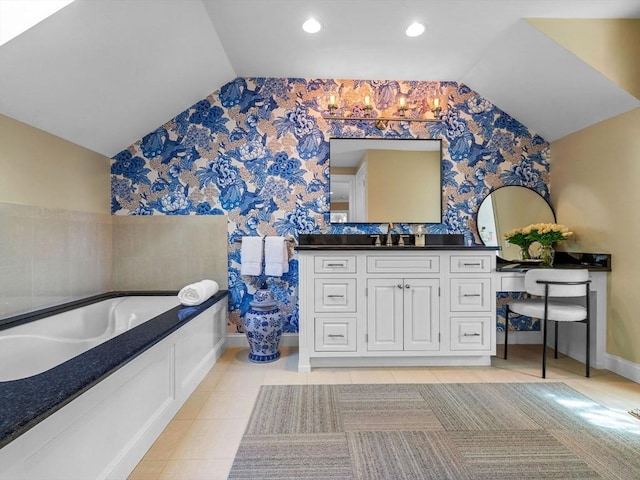 50 Temple Rd, Wellesley, MA 02482 - full bathroom with wallpapered walls, lofted ceiling, baseboards, tile patterned flooring, and a garden tub