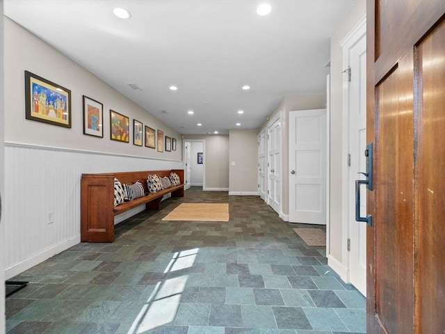 50 Temple Rd, Wellesley, MA 02482 - hallway featuring baseboards, recessed lighting, wainscoting, and stone finish flooring