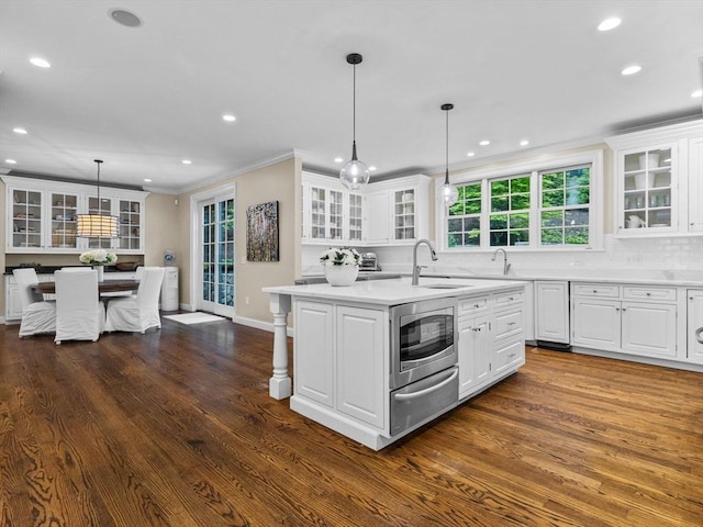 50 Temple Rd, Wellesley, MA 02482 - kitchen featuring a sink, a warming drawer, stainless steel microwave, an island with sink, and recessed lighting