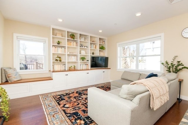 living room with recessed lighting, wood finished floors, and baseboards