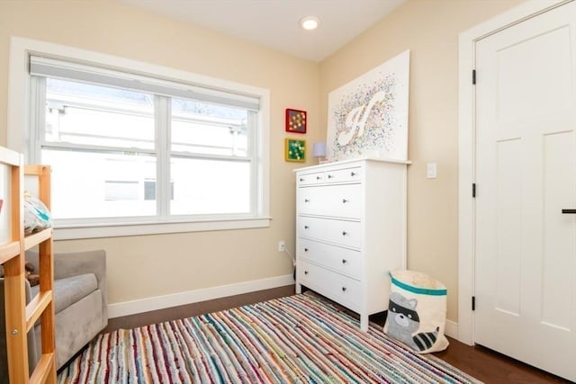 interior space featuring recessed lighting, baseboards, and dark wood-style flooring