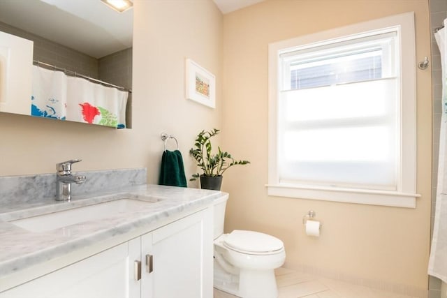 full bath with vanity, a shower with curtain, baseboards, tile patterned floors, and toilet