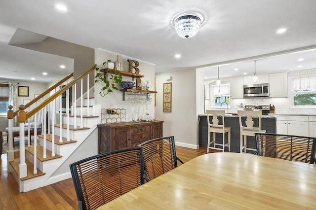 101 Eastern Ave, Woburn, MA 01801 - dining room featuring wood finished floors, recessed lighting, and stairway