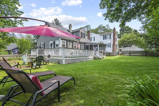 101 Eastern Ave, Woburn, MA 01801 - rear view of property with a fenced backyard, a sunroom, a wooden deck, and a chimney