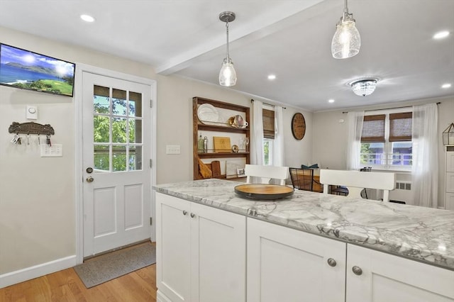 101 Eastern Ave, Woburn, MA 01801 - kitchen featuring light wood-style flooring, recessed lighting, white cabinetry, light stone counters, and hanging light fixtures