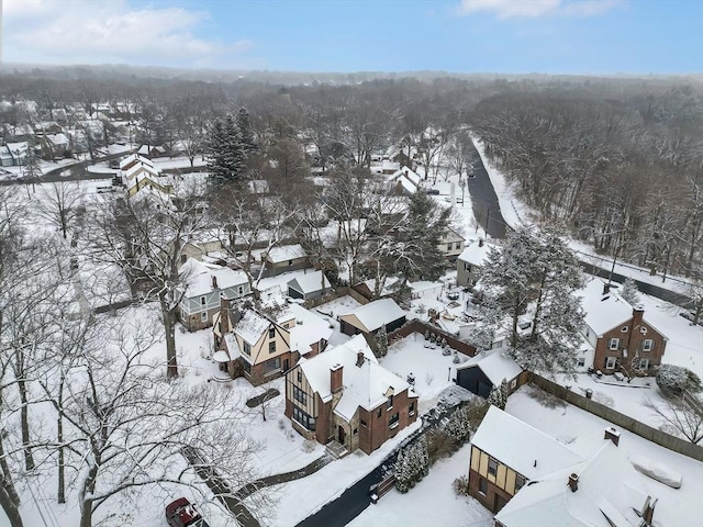 snowy aerial view featuring a residential view