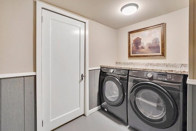 clothes washing area with laundry area and washing machine and clothes dryer