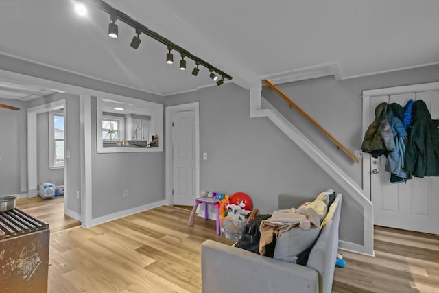 rec room with light hardwood / wood-style flooring