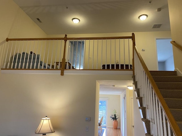 staircase featuring visible vents