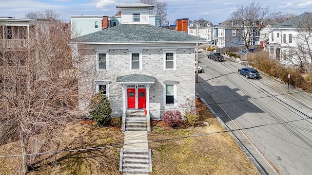 view of front of home featuring a shingled roof