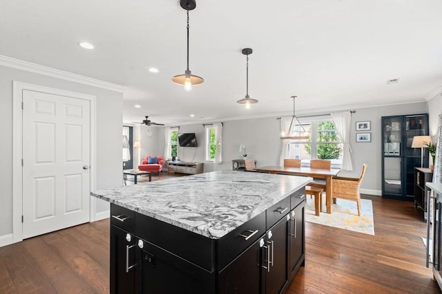 51 Waltham St Unit 3, Maynard, MA 01754 - kitchen featuring dark cabinetry, ornamental molding, recessed lighting, dark wood finished floors, and baseboards