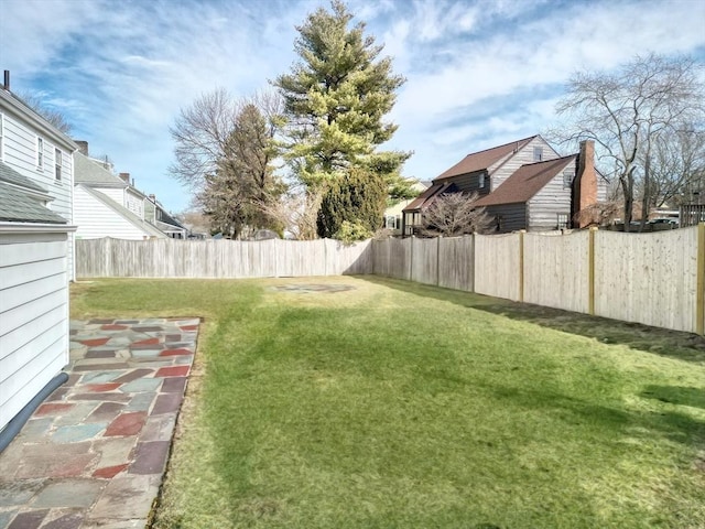 view of yard with a fenced backyard