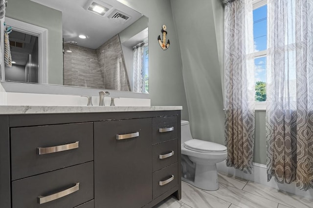 full bath featuring vanity, a shower with shower curtain, toilet, and marble finish floor