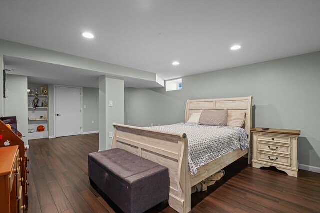 bedroom with recessed lighting, baseboards, and wood finished floors