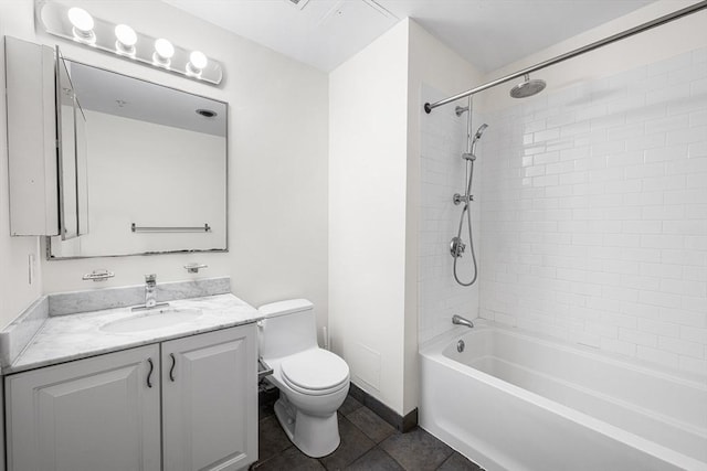 full bathroom with toilet, tile patterned flooring, vanity,  shower combination, and baseboards