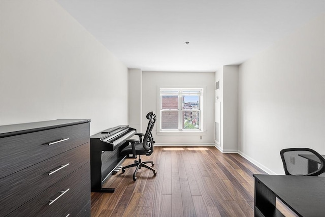 office area featuring dark wood finished floors and baseboards