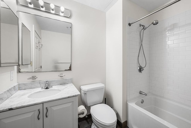 full bathroom featuring toilet, vanity, and tub / shower combination