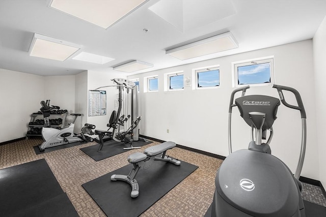 exercise room with baseboards