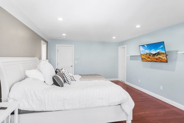 bedroom with dark hardwood / wood-style flooring