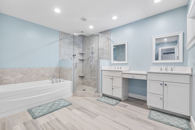 bathroom with dual bowl vanity, tile flooring, and plus walk in shower