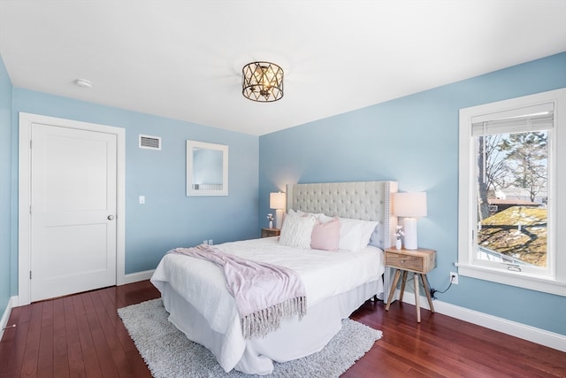 bedroom featuring dark hardwood / wood-style floors