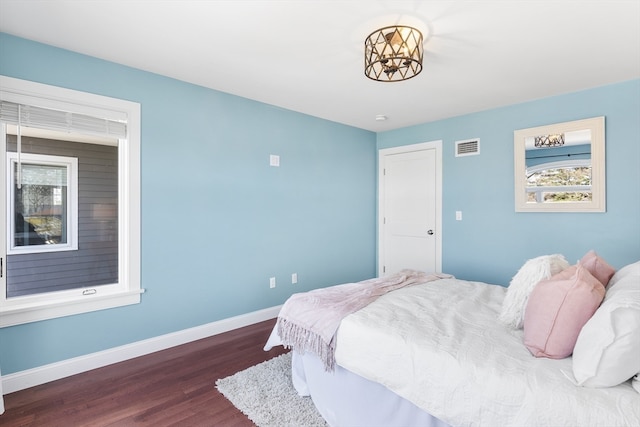 bedroom featuring dark hardwood / wood-style floors