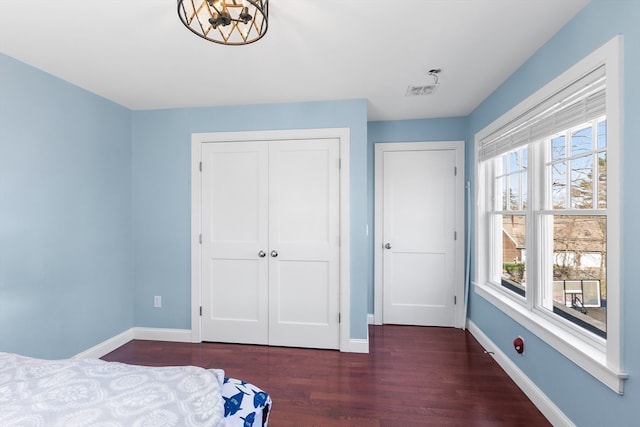 bedroom featuring dark hardwood / wood-style flooring