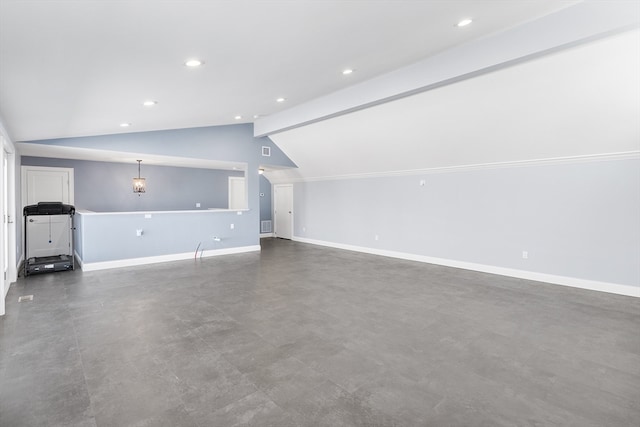 unfurnished living room featuring lofted ceiling with beams